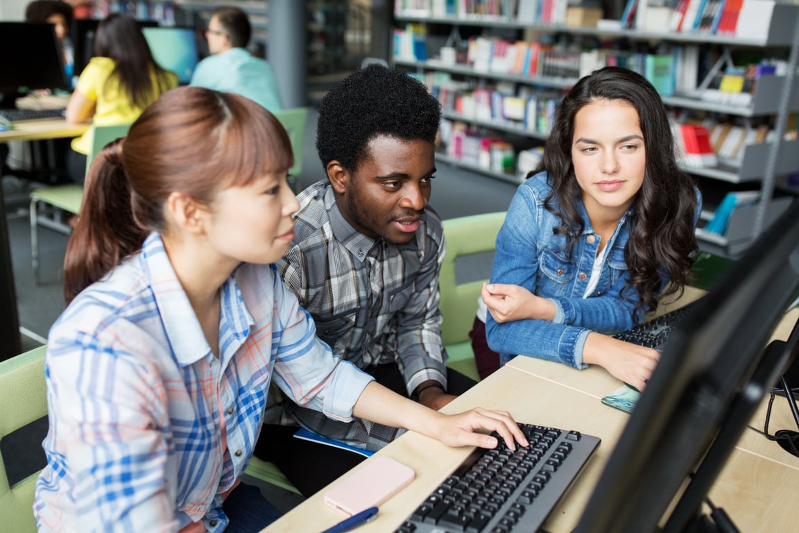 International Students with Computers at Library